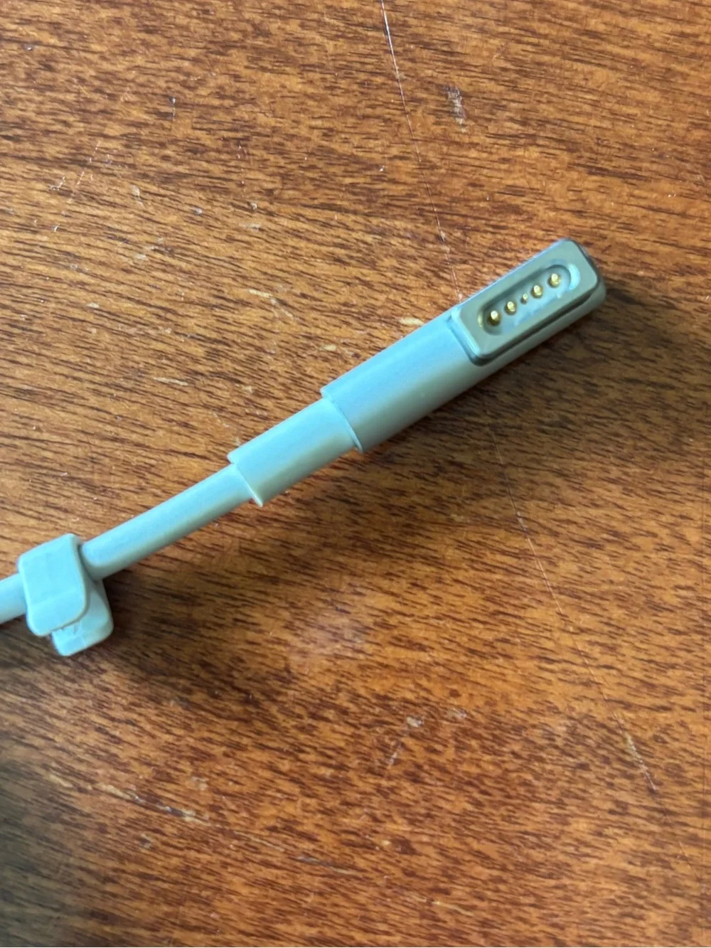 Apple MagSafe power adapter with a fold-out wall plug duckhead attachment